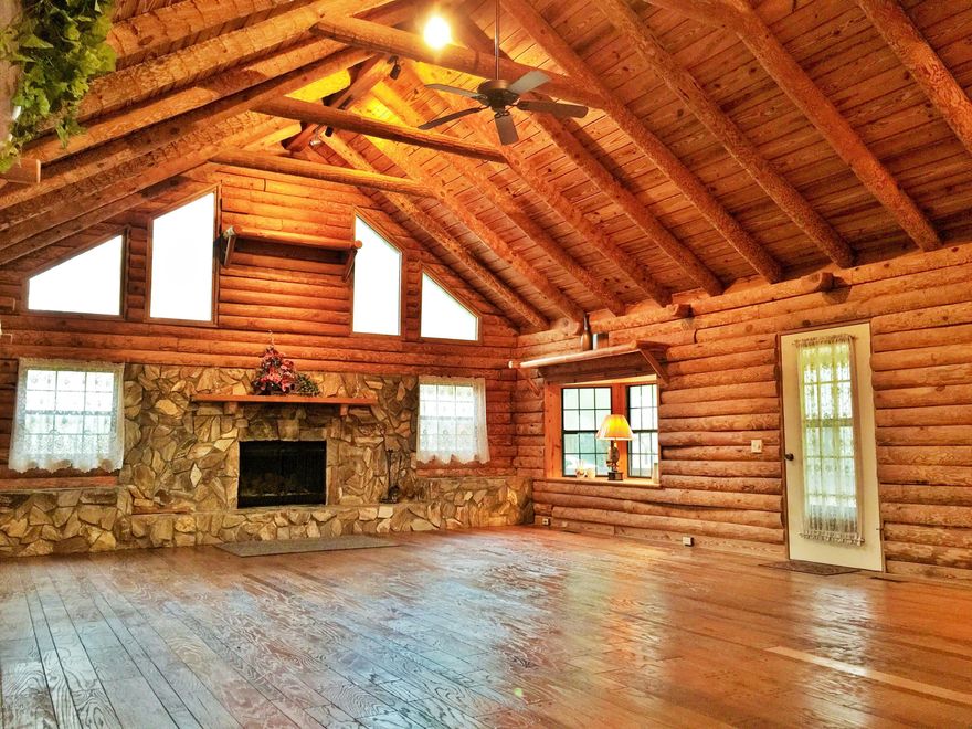 /*/*/*/ The LOG CABIN /*/*/*/ HUGE CABIN---> ACREAGE--->BRAND NEW COMMERCIAL GRADE STORAGE BUILDING---> COUNTRY LIVING!!! This is just a few things this one of a kind property has to offer! This massive cabin not only has a breathtaking living area but boasts a total of 10 rooms and 5 bathrooms! The gated cabin sits upon 4.65 acres and is also accompanied by a 40 x 30 commercial grade storage building with 3 bay doors to load and unload. The home also includes a spacious mother-in-law suite with it's own outside access door. There is a florida/sun room that is connecting between 2 of the 3 outside porches. There is also a poured concrete slab located on south end of property. All sizes and school zones are approximate and should be verified if important