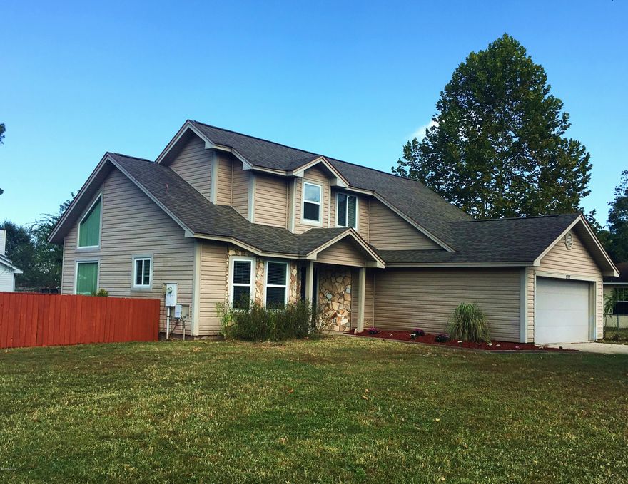 Contemporary design with rustic charm in a convenient Lynn Haven location. Situated on a corner lot in the small cul de sac neighborhood of Ravenwood, you'll love the curb appeal of this home-- almost 1/4 acre of yard for you to enjoy! Inside, the large kitchen boasts brick-style ceramic tile flooring, tons of cabinet & counter space, a pantry, & bay window breakfast nook. The diningroom & familyroom share a high vaulted ceiling, new wood-grain ceramic tile flooring, cozy wood-burning fireplace, & glass doors leading to a large deck overlooking the back yard. There is a 1/2bath downstairs for guests, as well as the spacious Master Suite. Be sure to check out the oversized walk-in closet in the master bath! Two more bedrooms & a bath are upstairs, perfect for the kids or as guestrooms.(more You just can't beat the location of this home-- Starbucks, Publix, and many popular Lynn Haven shops & restaurants are only a couple of blocks away.  However, you are also super-convenient to Panama City, the mall, 23rd St., and even Panama City Beach.  Ask your lender about USDA Rural Development Financing (100%!!) that should be available for this property.  At this price, you'll be spoiled for any other home-- so see it today, before it gets away!