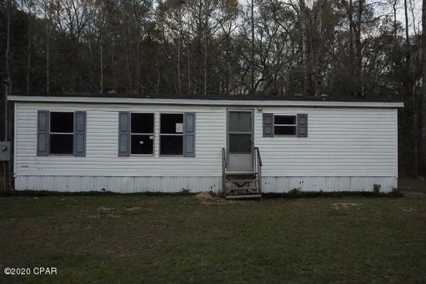 3 bd, 2 ba home on almost 2 acres of country living, close to Chipley for amenities, most of acreage is wooded so can clear more for a larger yard for pets or kids to play.  Needs some work but well worth it.