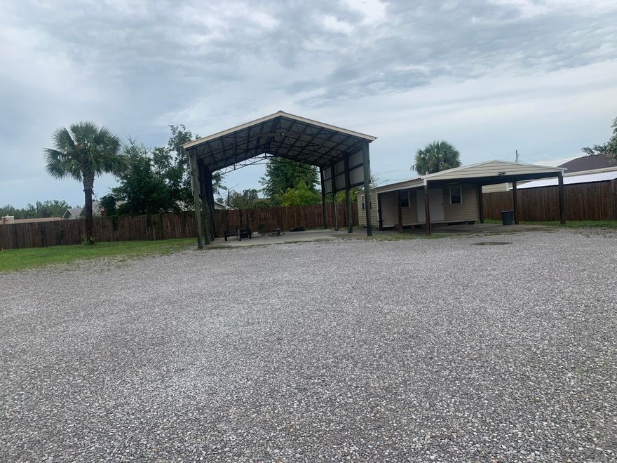 Large, centrally located residential building lot on Baldwin Road.  This lot features a pole barn and shed that will convey.  This lot is secured with a surrounding privacy fence with a double gate to allow for boat or RV parking.  Located near schools, parks, restaurants, shopping, hospitals, medical offices, and more. A quick drive to the Hathaway Bridge makes visits to the white sandy beaches and to Pier Park a breeze.