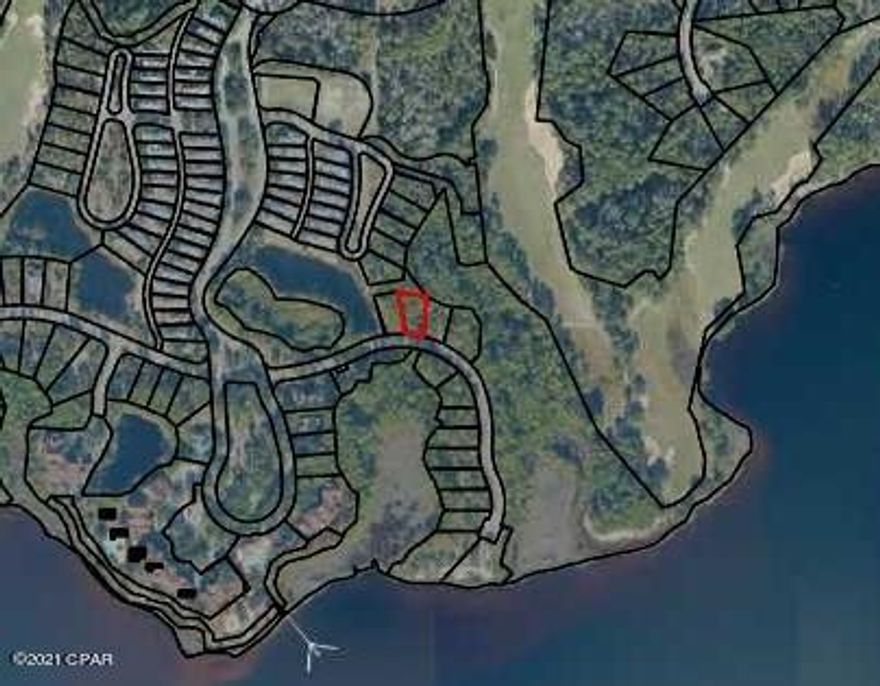 Own a piece of Paradise today. This beautiful lot is located within the gated community of Wild Heron, which features the Greg Norman-designed Shark's Tooth golf course and country club, scenic nature walks, fitness center with bathhouse, lake-view pool, boathouse, outdoor pavilion with outdoor kitchen, fire pit, playground area, and many community activities. Your new home will be within mere steps of Lake Powell, one of the largest Coastal Dune Lakes in the State of Florida and a perfect setting for kayaking, canoeing, and boating, which will be visible from your second floor. To ensure your privacy, no one will be able to build in front of or behind you. Wild Heron is close to the Gulf of Mexico as well as the beach communities of 30A, Northwest Florida Beaches International Airport, Pier Park, Panama City Beach, and all of the shopping, dining, and entertainment available in western Bay County and eastern Walton County. The owners are open to including board-approved Architectural Preliminary Plans and Tree Survey.