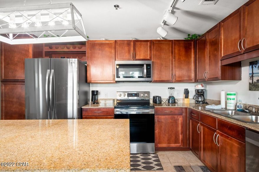 Awesome updated first floor unit. No Elevator Needed to access this unit! The garage offers covered parking. The balcony offers lake views on the ''quiet end'' of the building. The updated unit features new stainless-steel appliance, hot water heater, many new fixtures, LVP flooring, and the entire unit it is in amazing condition. The unit has been a vacation rental and has done extremely well in its history. The unit is being offer completely furnished down to the flatware. Nothing is needed to make this rental start generating income immediately. The complex offers 5 pools 2 hot tubs, gym, lake, private beach access but also public beach 34 is across the street. All measurements are approx. and if important should be verified.