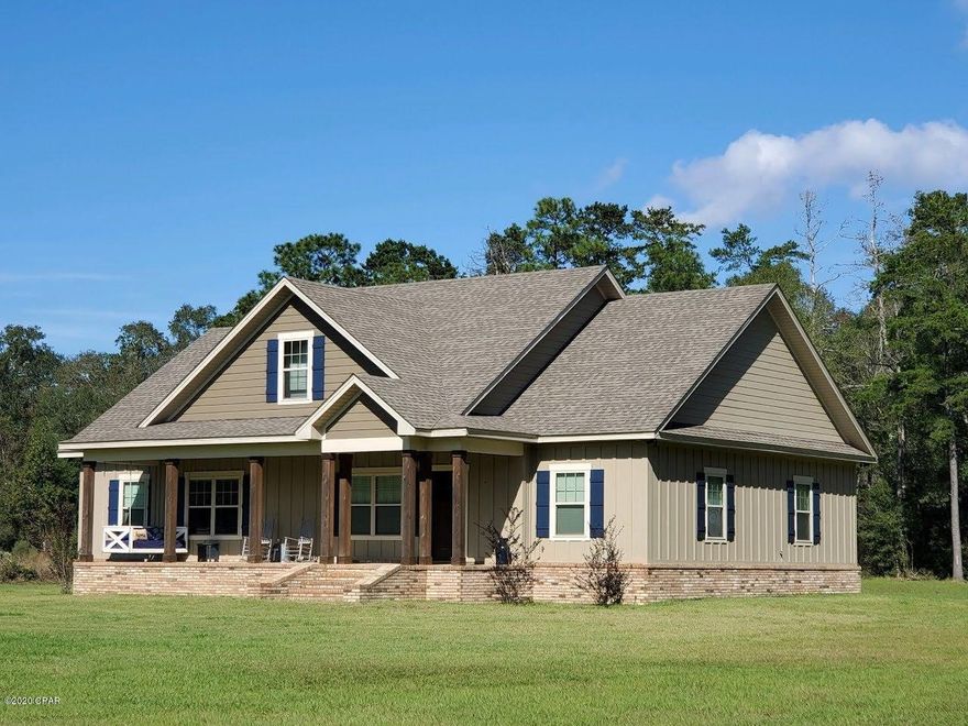 Take a look at this amazing immaculate custom built 4 bed 2.5 bath home sitting on 7.7 well manicured acres in Bonifay. This

home features a gorgeous open concept main area with 14' high beamed ceilings, gas fireplace and hardwood look tile. The kitchen boasts quiet close custom cabinets with granite countertops, GE Profile appliances and a massive eat at island.  The master bedroom hosts a beautiful trayed ceiling with interlock pine. The master bathroom is great sized with double vanities and custom cabinets as well. The huge walk in closet has plenty of space and also features pull down stairs for attic access. The attic is floored and finished for all you storage needs. The 4th bed/ flex room is large and has 220 volt power supplying a tanning bed. The  additional bedrooms are both Oversized and have ample closet space with ceiling fans. Large laundry room. The front and rear patios are huge and give you extra space to enjoy the beauty of the landscape and nature. Close to a natural spring fed creek just steps behind the lot for you to use and enjoy. A open pole barn is there for your toys or equipment.
