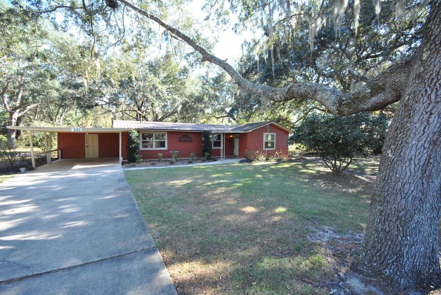 Priced to sell Quickly, this beautiful, huge corner lot with massive oaks. This 3 bed/2 bath home has been completely remodeled.   An opportunity like this, for a solid home with gorgeous oaks does not come about often.  Country living feel while being close to Tyndall AFB, shopping, and boating. Has concrete slab for workshop.  Lawn irrigation is on private well.  All measurements from owner.
