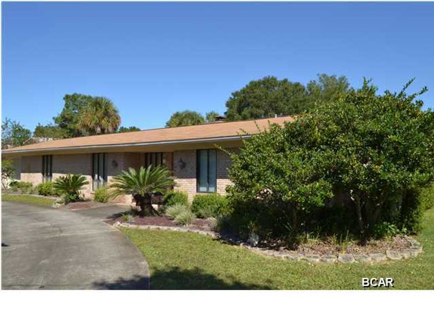Super clean 3 bedroom, 2 bath home located within minutes of 23rd St shops, restaurants and employment, the Panama City Mall and located just down the street from Haney Tech and Mosley High. This home is in the perfect, central location to everything in Bay County. The interior of the home is large and open with a great room with a wood burning fireplace adjoining the kitchen featuring granite counter tops, solid wood cabinets and a large dining area. The living room has an amazing view of the covered patio and 29' diameterin ground pool. Luxurious is what describes the master bedroom with an entire wall of mirrors set over the double vanities and open to the rest of the bedroom. The master also features a spaciouswalk in closet with plenty of shelving and storage. A second bedroom