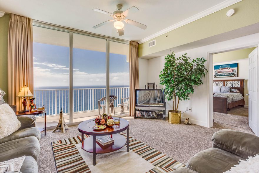 You must see the stunningly excellent 180 degree panoramic views of the sparkling emerald green gulf waters and white sand beaches from sunup to sundown from this one bedroom Master on the Gulf, two bath with bunk area unit. Close to the east end of the building, unit 2715 offers 923 sf of pure comfort.  The floor to ceiling sliding doors in both the living area and Master bedroom allow for the natural light to shine in.  Kitchen offers granite counters with updated stainless appliances. This unit is exquisitely decorated in warm earth-tones with beautiful furnishings throughout. Tidewater is a vacation rental dream with 2 outdoor pools, indoor pool, Tiki bar, restaurant, steam/sauna, fitness room, full movie theater, convenience store, beach service, gift shop, covered garage parking and and on site rental and assoc. mgt. Located just west of the nearby Pier Park Shopping Mall and all area dining and activities. Unit 2715 at Tidewater is a MUST SEE!