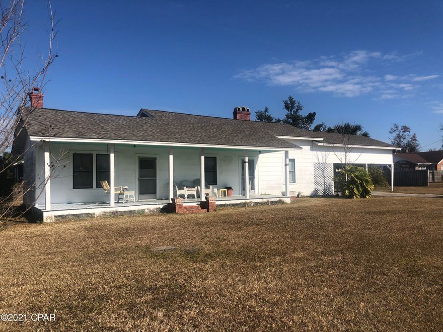 CURRENTLY UNDER CONTRACT. SELLER ACCEPTING BACKUP OFFERS. Check out this house just 4 blocks to the Bay in an established neighborhood and UNDER  200,000! This home is situated on a large corner lot in one on the best areas in Lynn Haven. It offers 3 bedrooms, 1 bath with a large living room and dining room/kitchen.  There is a very spacious carport and laundry room attached and a huge front porch to enjoy summer evenings. Close to everything.. shopping schools and restaurants. Call today to make an appt to see this one.