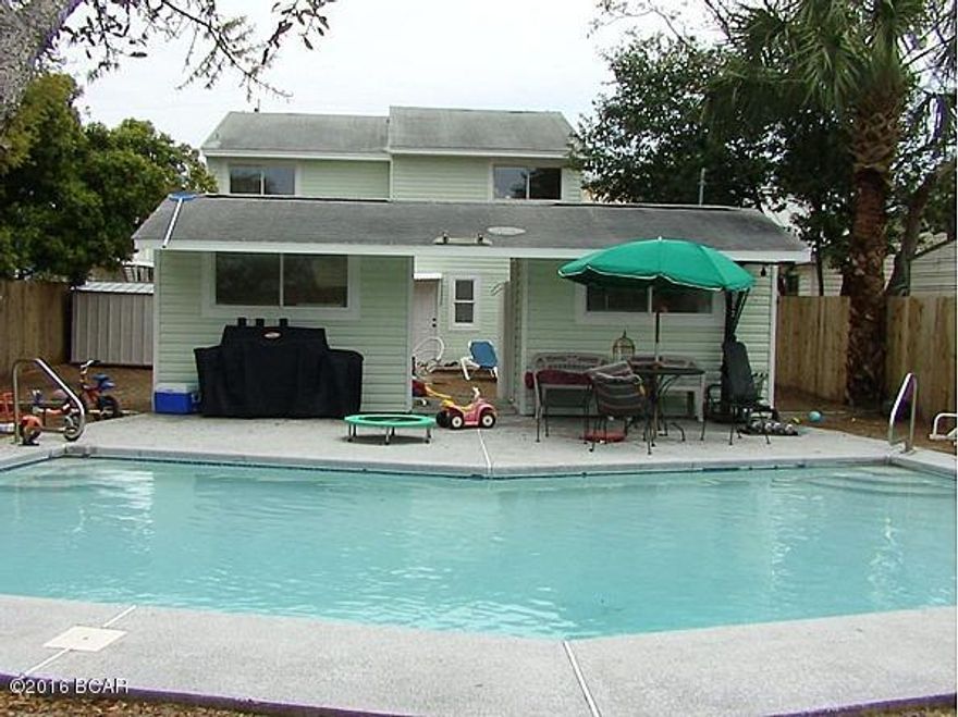 Very unique rental with a semi-private swimming pool in a common area in back, yet it also has a privacy fenced back yard for the unit's tenant! Rent incudes pool electricity and maintenance, water & sewer, and yard. Why buy when you can rent a home 100 yards from the beach like this one? (Please note some photos may not be exact and from the other unit.)