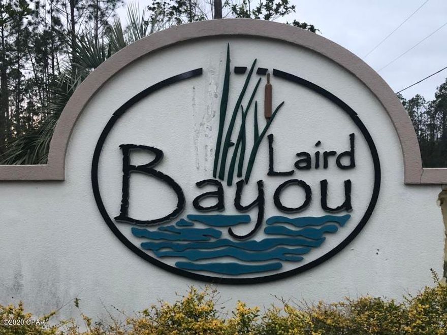 Great lot to build on, at almost an acre (0.75) in the desirable Laird Bayou.  Lot is high and dry and ready for your dream home.  It is 20 minutes from Tyndall A.F.B. and Callaway.  A gated waterfront community  to include a boat launch, dock, fishing, RV boat storage,pavilion/gazebo and pool. Great fishing off the dock and just a short ride to Shell Island.  Underground utilities and custom built homes throughout the subdivision allready built.  Make offer, seller is ready to sell.