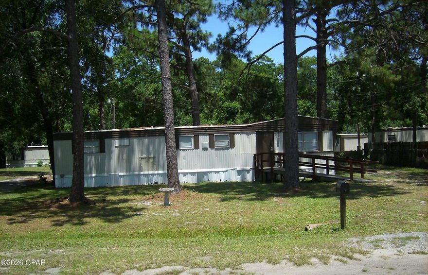 This investment collection is part of 3 lots that can be purchased individually or all together. This one is Parcel ID's 27779-015-000. This one has a mobile home that has no value and is occupied. The property is zoned R-2(BC) which permits two townhomes to be built or a duplex. Buyer can purchase one property or all three at one time. Each property has it's own septic and sewer is available nearby. A power pole is also on each property. The white mobile home and the storage unit on 2412 Dorothy A&B does not convey. Possible financing available with a builder to build your investment/income property.