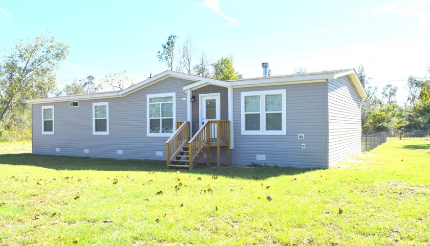 Home Sweet Home! This is what you will want to say after seeing this 3-bedroom, 2 bath, 2018 mobile home. If you like an open concept, split floor plan with plenty of room this is a must see! Step inside and you are greeted with a spacious living room boasting a gas fireplace, open country kitchen with large island and dining area, master suite with double vanities, custom shower and a massive walk-in closet. Step outside through your sliding glass door to a concrete patio with gazebo, chain-linked fenced backyard, portable storage building, and livestock pen, all secluded on an acre lot. Property is located off a paved road just off Hwy 231, north of Cottondale city limits.