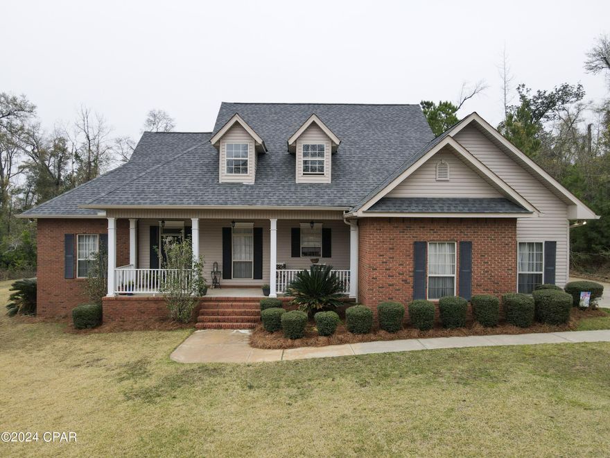 Pristine and welcoming are the thoughts evoked when you arrive at and enter this meticulously landscaped, squeaky clean traditional home.  The quiet, wooded  neighborhood would never suggest this property to be within a mile of Jackson Hospital and Chipola College in Marianna.  Three bedrooms and 2 full baths thoughtfully frame the open concept living room, dining room, and kitchen for a total heated and cooled footprint of 1864 square feet.  The high ceilings lend a sense of grandness and the neutral color palate is calming and versatile.  An oversized garage has ample space for dry vehicle storage and more.   Whether you're dreaming of a shop, pool, child or pet play area, garden, etc., many possibilities exist outdoors since the 0.87 acre lot is all cleared and without structure.  A tour of this beauty is all that you need to know that it's the perfect place to call home!