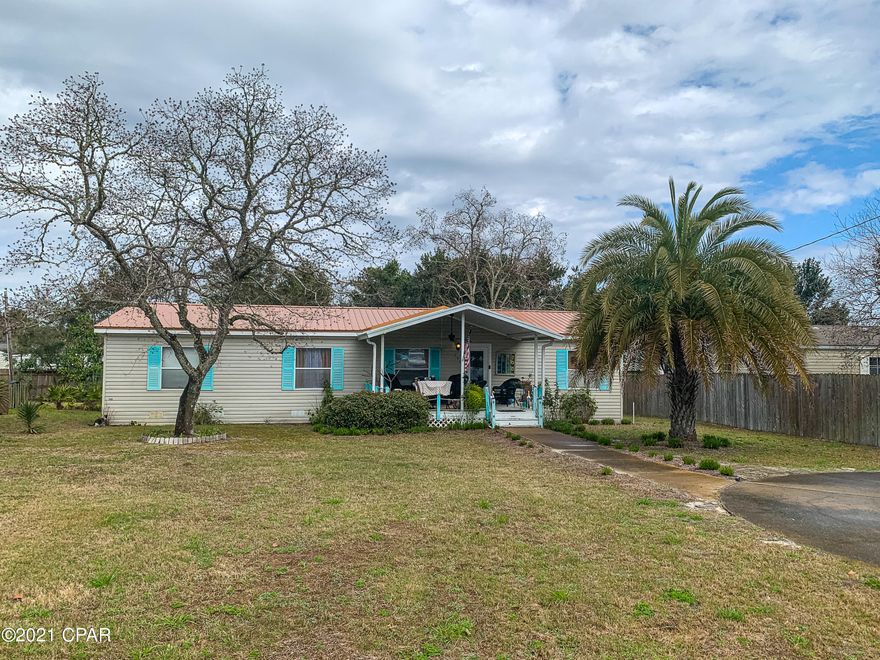 CURRENTLY UNDER CONTRACT, SELLER ACCEPTING BACKUP OFFERS. This spacious manufactured home offers an open floor plan and great outdoor living spaces. This home has three bedrooms and two baths in a split floor plan with a large great room and a nice sized kitchen and laundry room. It sits on .223 acres and features a large front porch, 16X32 foot covered back porch (half screened in and features a double sink for outdoor cooking), an above-ground pool, and a large shed/workshop with double doors and enough space to park a golf cart. This property is located on the quietest end of Panama City Beach and is a short 5-minute drive to the beach and 30A, 10 minutes to Pier Park, and close to grocery stores, restaurants, and shops.