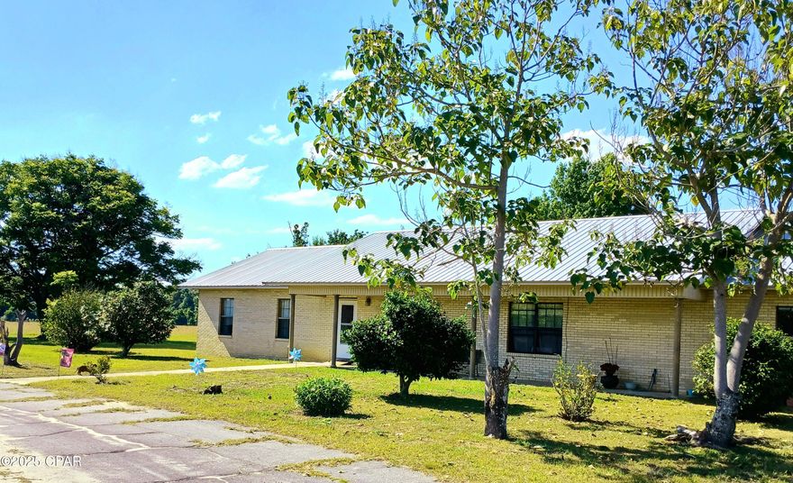 CURRENTLY UNDER CONTRACT, SELLER WILL CONSIDER BACKUP OFFERS.  
You must see one of the most picturesque drives on the road to this 4 B/3B home on this 60 acre dry farmland ready for your family dreams to be complete. The road is  a tunneled canopy of beautiful trees leading to the home's large circular drive.  There are a pecan trees, a well and sprinklers inside the circular drive. There is also an antique hand pumped well on the property, so there is an abundance of water. This farmland has been leased for the past few years to grow and cultivate hay.  This home has split floor plan with 3 bedrooms and one on-suite bathroom on one side and master suite on the other. There is an additional room that could be used as a 5th bedroom.   There is plenty of parking with the 2-car garage and 
large, covered patio for your family get togethers.  There is plenty of storage in this home and a very adequately sized laundry room with utility sink.  The dining area and family room are separated by a unique wall of cabinets.  Call agent directly to schedule a tour today.  Do NOT use Showing Time, please.