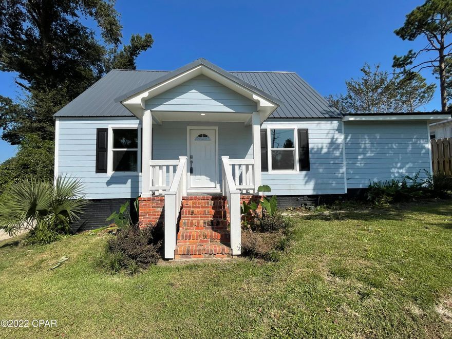 MOTIVATED SELLER; WILL CONSIDER ALL OFFERS... Turnkey 3 bedroom, 2 bathroom home in downtown Marianna. This home has been completely remodeled, & features all new kitchen cabinets, appliances, roof, bathrooms, & Hardie board siding. Some of the flooring is original hardwood floors that have been refinished & some are new vinyl plank wood-look floors. All major systems are new including wiring/electrical, HVAC & ductwork, all plumbing & fixtures, & high e efficient insulated windows. The master bedroom has en suite bathroom w/ double vanity, new tiled shower, & large laundry room. The other downstairs bedroom is spacious & offers plenty of natural light. The upstairs bedroom is large enough for two. There is a covered porch and an open deck on the back of the home as well as a handicap accessible ramp. This home is located just up the street from Wynn St Park and downtown Marianna. It is close to Jackson Hospital, Marianna schools, and all of the conveniences of downtown living. Seller will offer $5,000.00 towards buyer's closing costs.