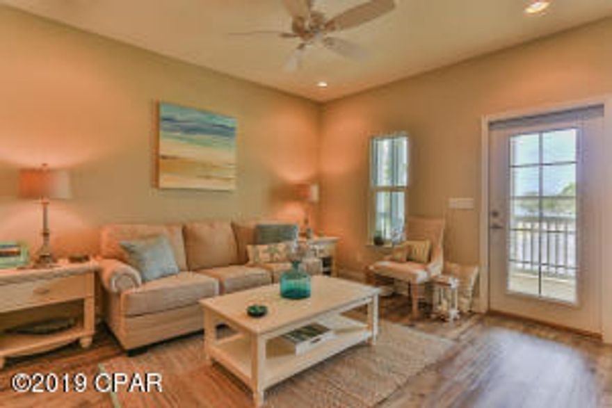 NEWLY COMPLETED CONSTRUCTION- TOWNHOME LOCATED IN A LAKE COMMUNITY. $40K PRICE REDUCTION!! Townhome has a BEAUTIFUL VIEW OF THE LAKE from the Kitchen, Family Room & Balcony. Perfect for Easy Access to Hwy 98, Airport, and minutes from the Beach and 30A. This spacious Townhome residence offers a one-car GARAGE, large pantry & lots of storage!! NEW 2018 AC, Hotwater Heater, and new stainless steel appliances including refrigerator, Quartz countertops, walk-in laundry room, all wood cabinetry with soft close (upgrade), WOOD  FLOORING THROUGHOUT, ceiling fans, window treatments, Large Balcony with Lake View, impact rated doors and windows, Fencing Backyard for PETS and PRIVACY. Enjoy the waterfront lifestyle of boating, or kayaking on the lake or short walk to the beach. Boats are allowed on Lake Powell and a public boat ramp is at the end of the street. THIS NEWLY COMPLETED CONSTRUCTION TOWNHOME UNIT IS AVAILABLE NOW, INCLUDES UPGRADES, AND CURRENTLY PRICED $16,000* LESS THAN BUILDING 2 WHICH WILL BE COMPLETED LATE SPRING/SUMMER OF 2019 (*unit, 22944 Ann Miller).  Only 25 total townhomes and 4 Buildings in this new lake community development. Community has a 30 day minimum rental restriction.