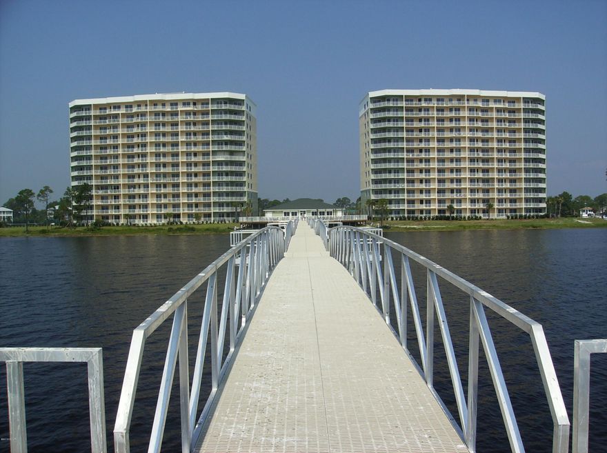 OWN IN THIS EXCLUSIVE GATED COMMUNITY ON THE WATER WITH BEAUTIFUL PANORAMIC VIEWS OF ST. ANDREWS BAY AND THE HATHAWAY BRIDGE. ENJOY YOUR COFFEE WITH AMAZING SUNRISES AND END YOUR DAY WITH MOONLIT NIGHTS. YOU WILL NOT BE DISAPPOINTED WHILE LIVING THIS LUXURIOUS WATERFRONT LIFESTYLE WITH AMENITIES SUCH AS BAY FRONT POOL, HOT TUB, EXERCISE ROOM, OWNERS COMMUNITY ROOM, TENNIS COURT, FISHING PIER AND BOAT DOCKS. GARAGE AVAILABLE TO PURCHASE SEPARATELY.THIS IS TRULY A 'ONE OF A KIND COMMUNITY' IN THE PANHANDLE.