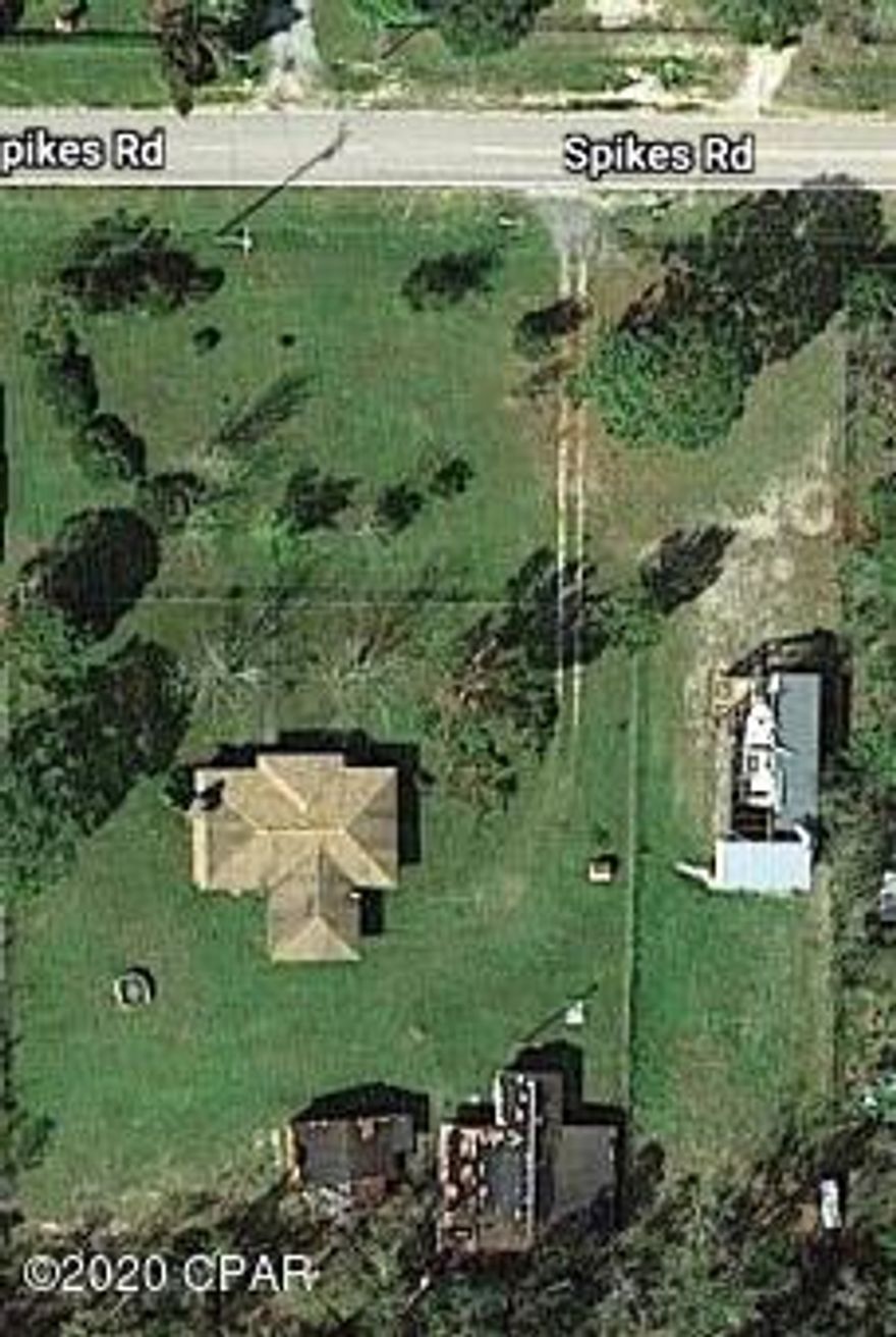 Ranchette home located just south of Hwy 20 on Hwy 77 with large barn, fenced vegetable garden area, 6 kennels in place with fenced outside area and office, small barn with office all located of 1.9 acres. Enjoy a farm living with space to keep horses, goats, chickens, or pigs! This 3 bedroom 2 bath home has a remodeled kitchen with granite counter tops and updated kitchen cabinets. Family room with fireplace and screened back porch to enjoy sitting outside. New roof and a/c. Some water stains still in foyer area.