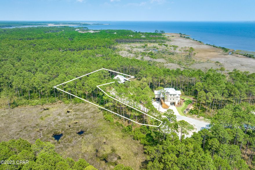 This property has sold! Discover similar listings by reaching out to us for an updated list of available properties that match your preferences.. Experience the tranquility of this exceptional lot nestled within the highly coveted RiverCamps waterfront community. Here's your canvas to build the home of your dreams, tucked away on a peaceful cul-de-sac with breathtaking views of the bay. This idyllic enclave is surrounded by three bodies of water - West Bay, Intracoastal and Crooked Creek - and 1500 acres of natural preserve. The less than 450 homes in the neighborhood take up 500 acres of land with the remaining 1000 acres committed to conservation. 

Owners can take advantage of the convenient dry boat storage and community boat ramp, offering swift access to West Bay. A mere 30-minute boat ride separates you from the shores of Shell Island and the Gulf of Mexico. With the airport a quick 10-minute drive away and Pier Park, along with Panama City Beach's famous sugar-white sand beaches just 15 minutes from your doorstep, this lot is a gateway to coastal bliss. More incredible amenities will be added soon. Don't miss this opportunity to claim this piece of paradise!