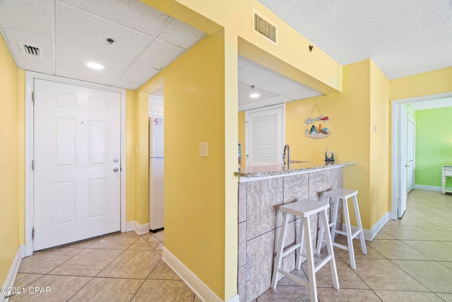 ***Gorgeous 4th floor 1bd, 1 ba Long Beach Resorts beautifully furnished and upgraded condo!!*** Granite countertops, wood cabinets, and tiled throughout. 2018 A/C and 2019 water heater. This unit is a rental cash cow and already booked through the summer. ALL RENTALS ON THE BOOKS PAST THE CLOSING/SALE DATE MUST BE HONORED, NO EXCEPTIONS. Amenities in this gated resort include 3 pools(one with a waterfall), a poolside bar and restaurant, fitness center, hot tubs, and a dedicated beach. You are minutes away from some of the best attractions PCB has to offer, restaurants, and about 10 minutes from Pier Park. All information is approximate and should be verified by buyers if important.