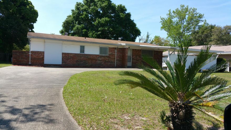 3 bedroom 2 bath home lots of room w/2 car covered carport.  This home features LP Gas Generator, hurricane shutters, Central Heat & A/C, All Electric, living room, den, dining, office, laundry room, large front yard, large backyard with 2 sheds and chain link fenced.