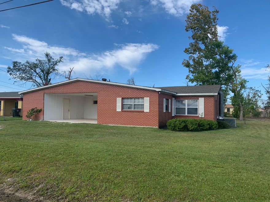 Very nice brick home in Lynn Haven, convenient to schools, churches, sports park and businesses.  This home has had many updates in the past year, including a NEW ROOF, new tile in the covered patio area, paint and more.  The floorplan is currently a 3 bedroom 2 bath with a bonus room that could be a 4th bedroom, the master was previously 2 rooms and has had dividing wall removed;  could be reconstructed back into 2 rooms if needed allowing for a potential 5 bedroom set-up for a large family, there is also a large foyer space that could be an office or separate dining or living area.  Home is situated on a LARGE LOT.  Lots of potential here! Call today, this one should sell quickly.