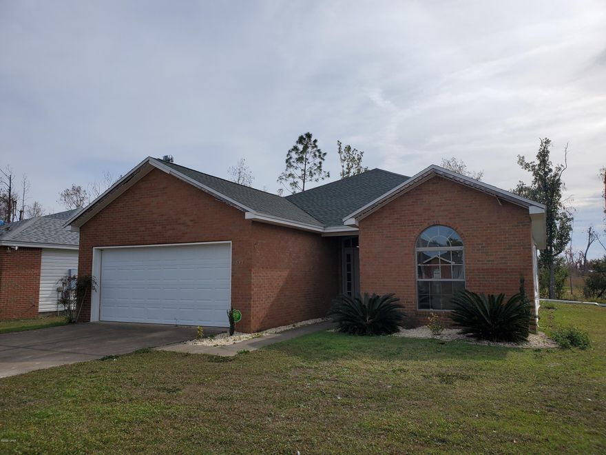 This Brick Front 3/2 is almost finished, and is being sold AS IS. This is a great opportunity to finish the home how you wish, and or get it Tenant ready. Could be a great Rental Investment property.  Most of the Hurricane damage has been repaired. Needs Attic insulation, drywall finished, Ceilings textured, Fixtures, Paint and flooring throughout, and the inside is complete. Soffits, Fascia, and siding to complete the outside. The backyard space has a Deck/Patio over the canal in the back. Located close to everything.  This is your chance, call today to schedule your private tour.