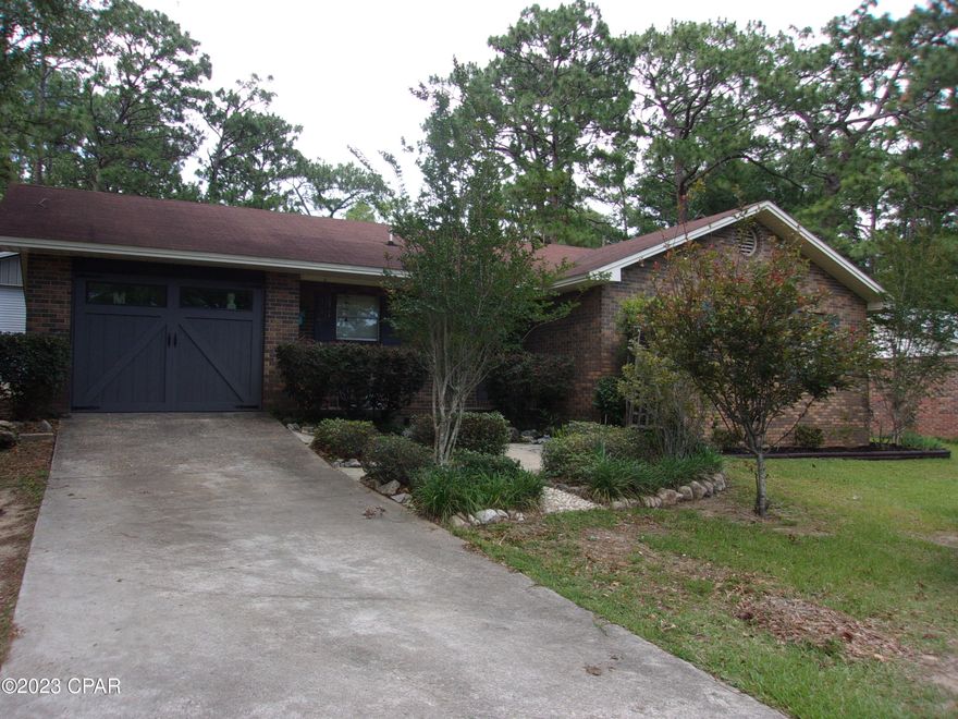 'CURRENTLY UNDER CONTRACT, SELLER WILL CONSIDER BACKUP OFFERS' Immaculate 3 bedroom 1.5 bath brick home on lot in the edge of the city limits of the small town of Bonifay. Open concept for large living room dining area and country kitchen. Bonus room could be used as a extra bedroom, Den, office of craft room. Has mostly nice tile flooring.  Some recessed lighting. Spray foam insulation in the attic adds extra insulation to lower electric bill. Real wood cabinets in the kitchen. Spacious laundry room. New air conditioner in 2018. New shingle roof in 2011. Outside you will find a detached 16 X 48 garage/storage building with a 12X 24 lean-too with concrete floor making a nice outside porch area. Garage/storage building has been well constructed with 2X4 studs just like a house and well insulated with spray foam to maintain a comfortable temperature in winter and summer. Private back yard is a beautiful flower garden with concrete walkways, arbors, trellises, sitting areas and a concrete patio with a built in firepit. Located on paved street and convenient to shopping, dining and churches., This is a must see and will be available  for long.  Check it out today.