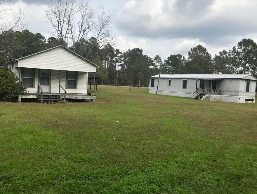 Investors!! This has two dwellings on it. It has a single wide with two bedrooms and one bathroom. It also has a house that could potentially be three bedrooms and one bathroom. There are no closets in the bedrooms so it can not be legally described as bedrooms. Great rental property on the same block as the elementary school. Measurements are estimated.