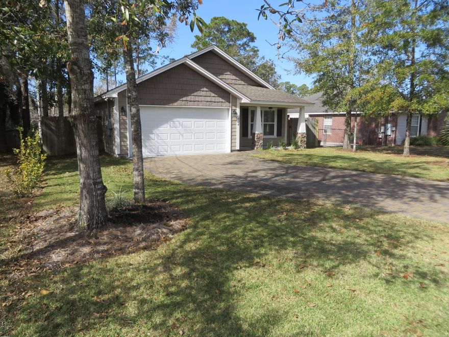 From the time you pull in to the driveway ,covered in pavers and a newly sodded yard with a new sprinkler system in the front yard. The appliances are all less than 2 years old. New wood flooring in the great room. This open floor plan with a center island kitchen and travertine-style tile in the kitchen and baths is great for entertaining. Plus, it is conveniently located within golf-cart distance to the Panama City County Club.
