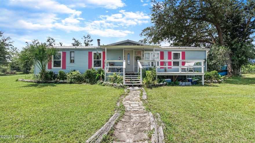 AFFORDABLE HOUSING ALERT!! This cute home situated on 1.6 acres in Bayou George is now ready for you! Spacious country living just a hop and a skip from the city! This home has had its title retired and is now a permanent structure! It is technically a 2/2, but there is a bonus area that is currently set up as a third bedroom. It would be relatively simple to close that space completely in to create a third bedroom if need be. Home also has a pool with a deck- but what truly sets this home apart is the size of the property!  It is a sprawling piece of land with plenty of space for kids and pets! Schedule a showing today! **All info is approximate and believed to be true- if important, buyer must verify!**
