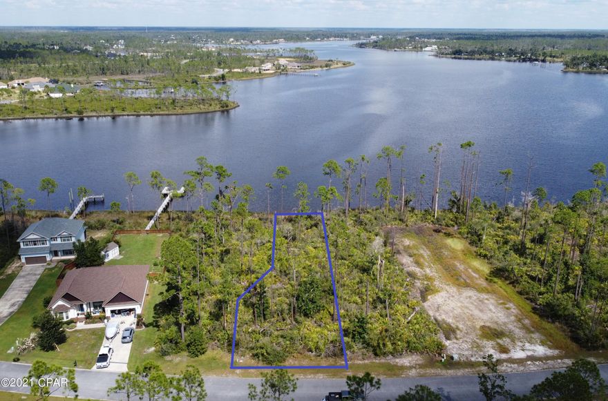 UNDER CONTRACT, TAKING BACK-UP OFFERS. Spectacular Deep Water parcel in the desirable Laird Point community! A boater's dream! This lot was one of the first ones chosen. Protected water with 4-5ft year round depths. Easy access to the Gulf of Mexico and East Bay. No need to spend money on a long boat dock to reach good water, the deep water is right behind the lot, and No worries of low tides or bridges preventing your access. At over a 1/3 of an acre you have plenty of space to design your new home. Laird Point is a gated waterfront community that features ribbon curbed streets and underground city utilities. Experience water views at nearly every turn. This community boasts the perfect blend of privacy and proximity. Beautiful homes throughout and new construction underway. Amenities include RV/Boat Storage and Tennis Courts.