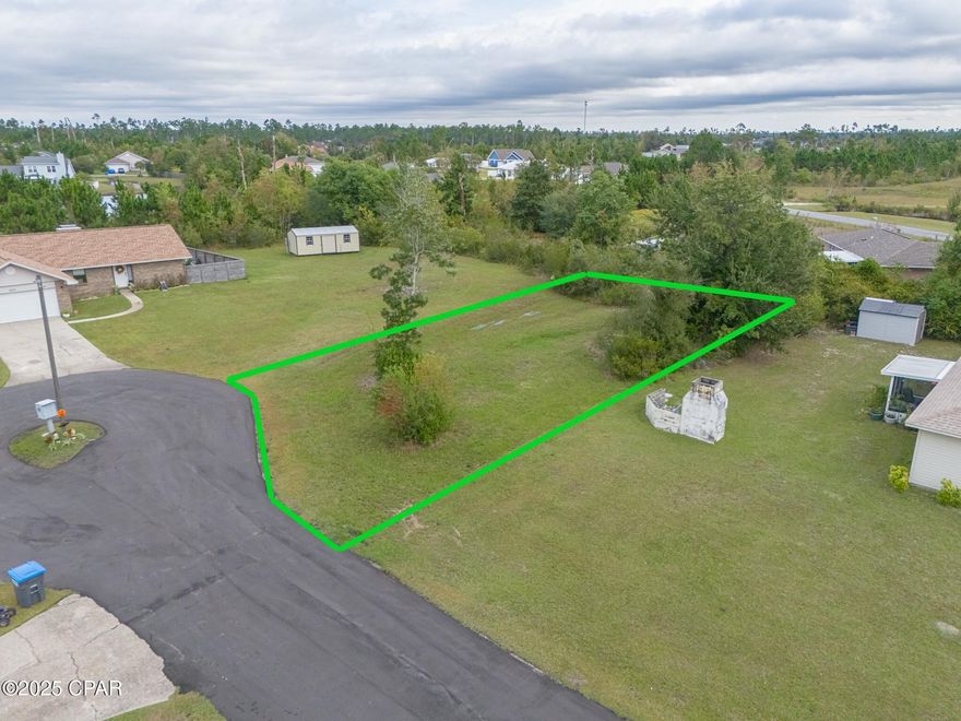 Welcome to 1997 Par Drive, tucked away in the peaceful Sandy Creek Ranch & Country Club—a charming, established community known for its privacy and welcoming atmosphere. This cleared 0.214-acre lot sits at the end of a quiet cul-de-sac, offering the ideal setting to build your dream home. With utilities available, a low HOA of just $400 per year, and location in Flood Zone X (no flood insurance required), this property is both practical and full of potential. Whether you're planning a full-time residence or a coastal getaway, this lot provides a rare combination of affordability, convenience, and tranquility. Bring your builder and imagination—this prime homesite is ready to go and priced to sell!

Enjoy peace of mind knowing this neighborhood maintains a high standard of living — single-family homes only (minimum 1,200 sq. ft. heated and cooled). No mobile homes, stilt houses, modular builds, campers, or RVs are permitted. Outbuildings or sheds are allowed only once a primary residence is completed on the lot, ensuring a consistent, well-kept community look and feel.