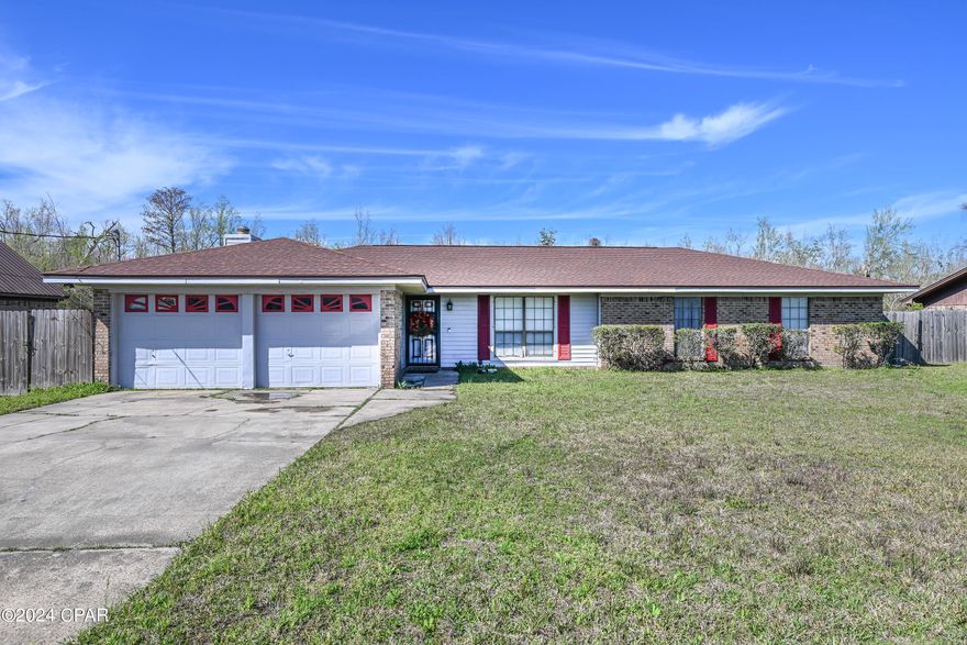 Welcome to a solid brick home on a huge lot (.697 acre) that backs up to woods for an affordable price!  This house boasts 1833 heated square feet, a large two car garage with two separate doors, and a huge lot.  It is beautifully decorated and has a lovely fireplace in the living room.  The permitted roof was done in 2022, as well as the water heater.  HVAC was done in 2014 and seller is offering a $2500 credit to buyer for the compressor to be replaced.  Ensuite bath in master suite make for convenient living. 
Home is close to schools, shopping, medical offices, Tyndall AFB, and the gorgeous beaches of St Andrew's State Park.  Make this solid and roomy brick home yours today!