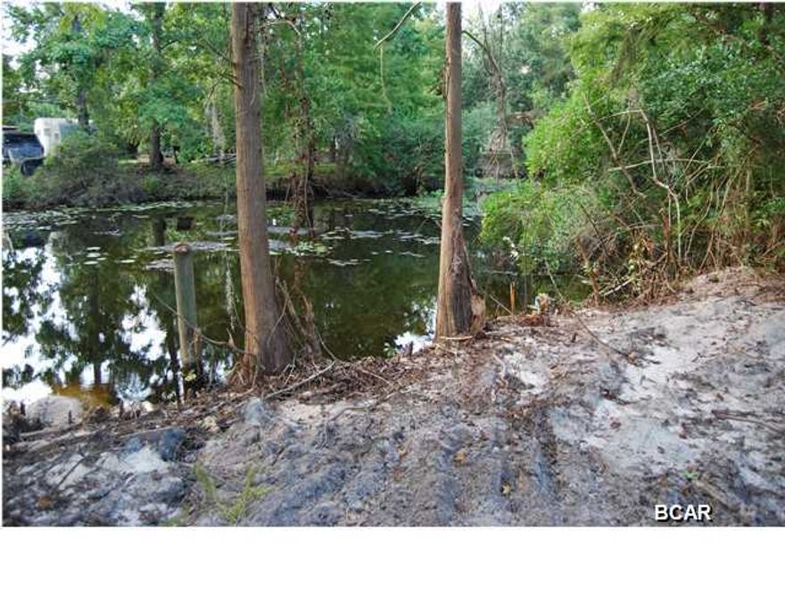 This cleared canal front lot on Deerpoint Lake is ready for your new home. It is a short distance to deep water in Deerpoint. Cherokee Boat Landing and Bait shop/store is right around the corner. Water level in canal always depends on if there has been a drawn down at Deerpoint dam but small boats should not have a problem most of the time.