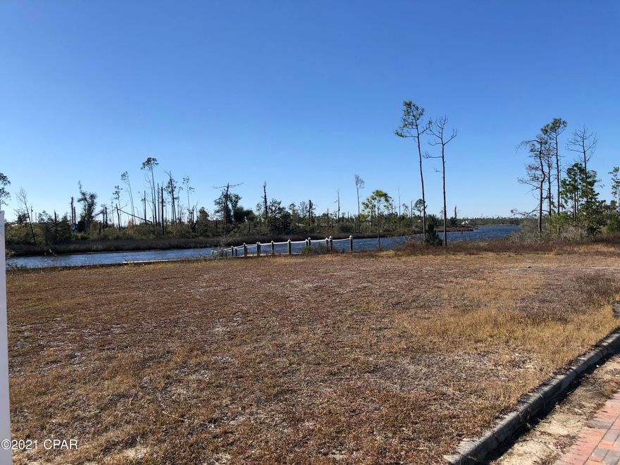 Subject offering consists of 139 developed lots with all infrastructure in place. On public water an sewer, the impact fees of $5,502 per lot are paid bringing the asking price to just $17,500/lot.  A part of the East Bay plat with 321 total lots, it is located on Cook's Bayou with deepwater access to St. Andrew's Bay, the Intracoastal Waterway and the Gulf of Mexico and just 10 minutes from Super Walmart, 20 minutes from Tyndall Air Force Base.  The existing roads in Phase I have been turned over to the City of Callaway for maintenance. This should allow for lower HOA fees. The roads have brick paver accents through out the project. Available separately, the +/- 6 acre marina site has over 650 FF on Cook's Bayou with dredgable deepwater near the shoreline. It has been cleared and comes wi over 650 FF on Cook's Bayou with dredgable deepwater near the shoreline. It has been cleared and comes with a 3,300 Sq. Ft. Club House and dock built in 2020. Near the marina site is a 2.72 acre site for RV/Boat storage. The 189 unfinished lots also have had their impact fees paid, again at $5,502 per lot.  The City of Callaway is primed for growth over the next few years with Eastern Shipbuilding getting the largest Coast Guard Cutter building contract in Coast Guard history and an expanded missions for Tyndall AFB. The Gulf Coast Parkway will run just East of the subject property. This will be a Hwy 98 re-route to bypass Tyndall AFB.