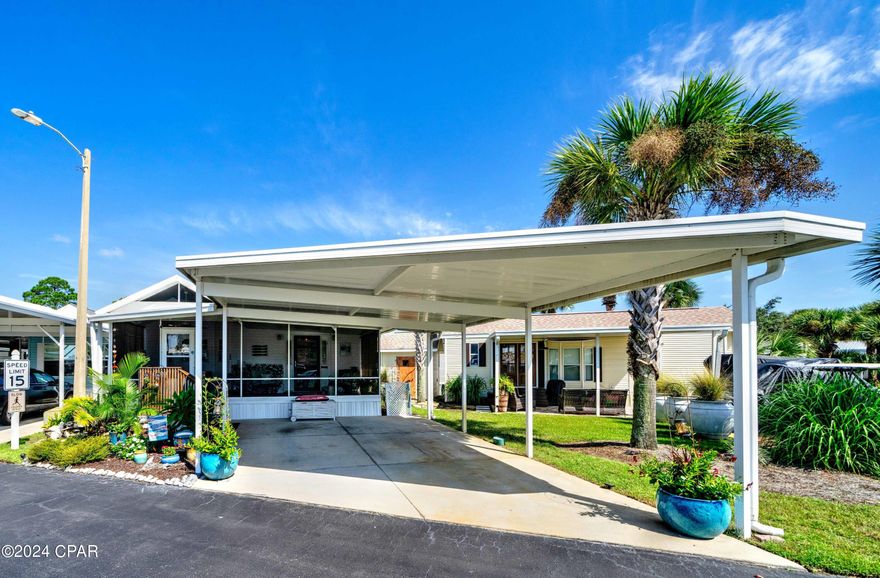 CURRENTLY UNDER CONTRACT, SELLER WILL CONSIDER BACKUP OFFERS - PRICED TO SELL - This beautifully updated beach bungalow located in Emerald Pointe Resort is perfect for a full-time residence, vacation home, or investment property, and it's move in ready for you and your family to begin making memories!. This home features a gorgeous 25 foot wide screened in porch, a nice sized living room, 2 bedrooms with a large master, 2 full baths, a large kitchen / dining area, a 2-car carport, and a 6x10 storage building, and its ALL ONE LEVEL once inside. The home has had many updates which include: shingle roof 2019, AC unit 2016, and since 2018, updates include a storage building, LVP Flooring, refrigerator, washer/dryer, steel supports under the home, 50-gallon hot water heater, aluminum awning over front steps, kitchen remodel, guest bathroom remodel, foundation vapor barrier under the entire home, and many more. Ask your realtor for the complete list of updates. The furniture on the screened patio is being included with the property. The home is located directly across from the secondary pool, private pond with boardwalk, and the dog walking area. This has been used as the owner's residence. Non rental and it shows! Emerald Pointe Resort is a golf cart friendly, gated community located in the heart of Panama City Beach close to restaurants, shopping, and the world's most beautiful beaches. Amenities include a large clubhouse, exercise room, 2 pools (one heated seasonally), hot tub, lake with boardwalk, and shuffleboard court. HOA fee includes water, sewer, garbage, cable, and lawn service. All information is approximate and should be verified by buyer if important.