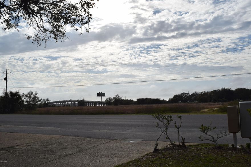 END UNIT with views that overlook the Bay Bridge. Short and Sweet commute to Tyndall AFB (only minutes away). West end unit offers beautiful sunsets from your balcony or porch, just bring your chairs. Nice stainless steel appliances. Clean unit with lots of great potential. Property has deeded water access to the bay for kayaks, swimming, sunbathing and/or fishing! County Boat Launch and Park within walking distance.