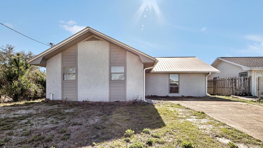 ACTIVE-CONTINGENT Seller accepting back up offers.

Location, Location, Location!! And now, REDUCED in price to give you the best value! This Classic Beach House is just minutes to the WHITE SANDY BEACHES.  The  open floor plan offers 3 bedrooms, 2 full baths and a GREAT ROOM with enough space for everyone. Easy care TILE FLOORING is featured throughout the common areas and baths. Outside, you'll love the BIG BACK YARD and the new METAL ROOF. The neighborhood is Golf Cart Friendly, a 5 minute walk to the BEACH and offers easy access to BOAT Launch on  GRAND LAGOON.  NO HOA's  and NO Flood Insurance required.  Don't wait to make this home your own!!