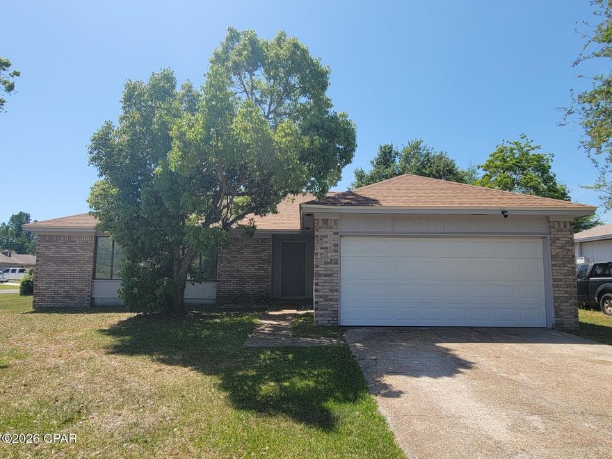 Nice 3 bedroom, 2 bath home with oversized garage. Spacious living room, and also has a formal dining area off the kitchen. New plank and carpet flooring was installed in 2020. Galley style kitchen equipped with refrigerator, range, and dishwasher. Master bedroom has walk-in closet. Fireplace is not operational. Located close to Mosley High School. Lynn Haven is a few miles away for shopping, restaurants, and other local businesses.  Schedule a tour today.