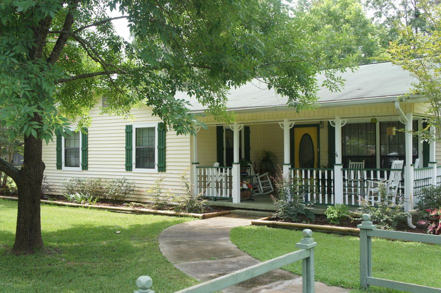 Welcome to the Garden of Eden!! Owners are Master Gardeners and this expansive 3/4 +/- acre property is breathtaking!!  Waterfalls in the background own your own piece of serenity.  Charming!! This house is in excellent condition with upgraded kithen and hardwood floors. An extra lot maintained with plants and trees and a single shed towards the back.  The workshop in back has three different rooms - a workshop, sewing room (adorable) and green house in the back.  If you are ready to live in paradise and one with nature this house is for you.