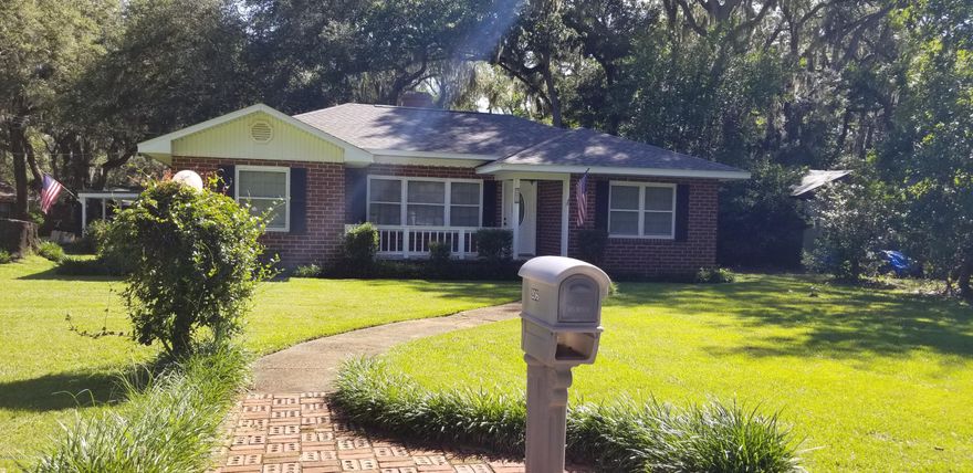 Old World Charm, meets New World Innovation! 

 Upon arriving at this beautiful 3 Bedroom, 2 Bath home you will see a lovely large Picturesque corner lot with lush landscape.This beautiful home with its large trees, Cobblestone walk paths,and Rustic brick exterior,and courtyard back yard, brings to mind Peacefulness and Serenity. Upon entering the front door you are transported back to a time Reminiscent  of family gatherings and cozy fireplace nights.Original hardwood floors as well as Mosaic hand laid flooring,stunning crown molding,and custom shutters gives this home classic flair. The kitchen boast of beautiful custom cabinets with crystal handles,and under cabinet lighting. Granite counter tops,Large sink and stainless steel appliances. Good size dining room with beautiful lighting.Th hallway has a beautiful built in cabinet with glass shelves. 3 nice size  bedrooms with good size closets. The main bathroom is updated. Off the kitchen is a small bonus nook that can be used as an office or storage/display area .Freshly painted this home is turn key ready! Once you step outside into the back courtyard you will see a large garage that was once used as a workshop to restore old cars and can be used for so many things. The laundry room is also located off the side of the garage and both are air conditioned. There is also a slab behind the garage big enough for an RV.There is also access to the lt from the ally. The roof is new and has a 30 year warranty. The plumbing and electrical were replaced in 2014. There is also well fed irrigation system to help keep the yard looking beautiful. Schedule your showing today!