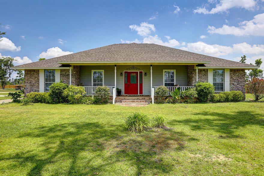 This house is a must see! Very nice, well-maintained home located on more than an acre. All brick exterior, vaulted ceiling and new electric fireplace in the living room, bay window in the breakfast area. Laundry room has built-ins with adjustable shelves providing lots of extra storage. Home has new roof, new carpet, and a newly renovated master bathroom.  Dining room and entry way have hardwood floors.  Screened-in back porch leads to the double carport with attached storage room.  Property includes 1152 sq ft workshop with car lift and an air-conditioned playhouse. Located just around the corner from Public access to the bay, perfect for kayaking.