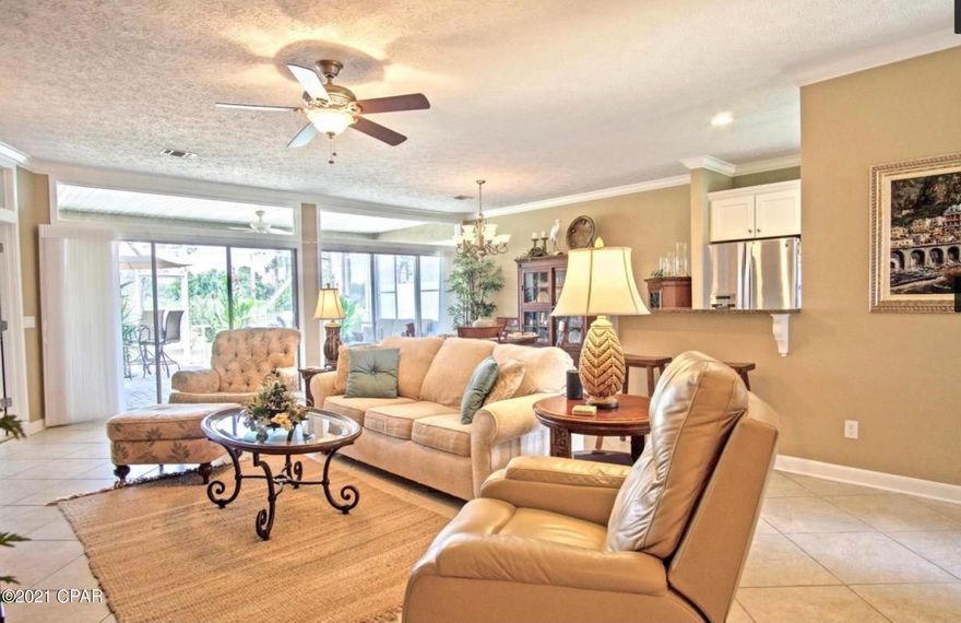 Come HOME to THE GLADES, an ESTABLISHED Panama City Beach community with LOW FEES -- so close to the SUGAR SHORE and emerald waters. This home has QUALITY AMENITIES both inside and out. The OPEN FLOOR PLAN with NINE FOOT CEILINGS, transom windows, and crown molding offers the SPACIOUSNESS you're looking for. Newer flooring, fixtures, and ceiling fans keep a fresh look. Formal dining space, SUNNY BREAKFAST NOOK, and BREAKFAST BAR SEATING allow for plenty of GATHERING PLACES near the beautifully-completed kitchen with its EYE-CATCHING, white cabinetry complemented by QUARTZ countertops, new backsplash, and STAINLESS APPLIANCES.