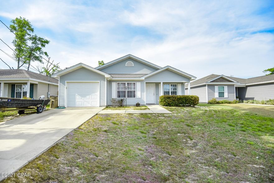 Newly Painted, and New Beautiful Vinyl Plank Throughout. This home features a HUGE Yard, dedicated dining space, 3 bedrooms also a front AND back porch. The Interior has beautiful soft gray wall color that will match any decor. The living room is spacious & has beautiful tray ceiling. The kitchen has a large dining area, breakfast bar & white cabinetry. The additional bedrooms are spacious & have nice sized closets. This home is in a great location right off 77 with quick access to Lynn Haven and other areas. Brand new construction next door in a quiet neighborhood! Make sure you don't miss out on this home!
