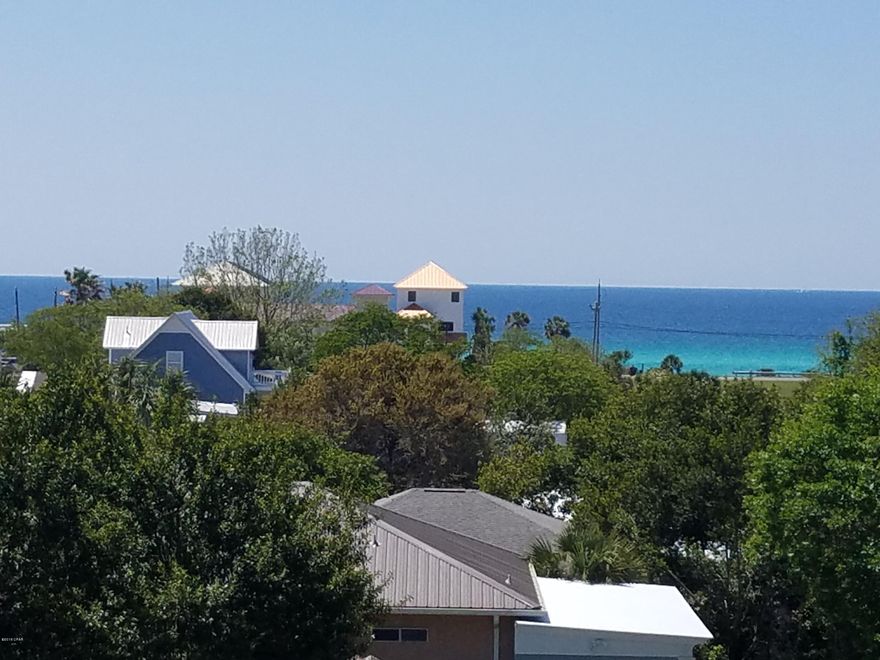NO BACK DOOR NEIGHBORS! These lots are super unique in Laguna Beach because there is nothing behind you but a natural area, no back-door neighbors. SEWER LINES HAVE BEEN RUN IN FRONT OF THIS HOMESITE. These lots are right in the MIDDLE OF THE DEDICATED BEACH, within 2 blocks of the beach. Very close to Carousel Market and Thomas Donuts. Just about the perfect location in Laguna Beach. GULF VIEWS FROM THE STREET. Lakeshore Dr. E. is a straight-shot street from Back Beach Road to Front Beach Road with a left-hand turn off Back Beach Road.   Bids for fill dirt are $6,800 for fill, $700 for dozier work and $1,500 for tree clearing.  Zoned R-2.