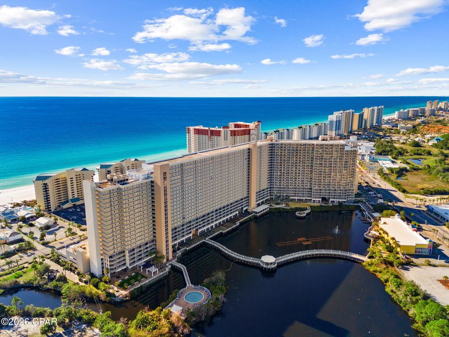 Looking for a condo that offers sweeping views of the emerald waters and sugar-white sands of Panama City Beach?  This condo has been completely updated with a tiled master shower, new flooring, light fixtures, tiled backsplash in the kitchen, and so much more!

Floor-to-ceiling glass doors lead to a private balcony where mornings begin with the sound of the waves and evenings end with unforgettable sunsets over the Gulf.

Inside, the open living and dining space is designed to make the most of the view, creating a relaxed coastal atmosphere ideal for unwinding after a day on the beach. The kitchen provides plenty of cabinet space and a functional layout for preparing meals before heading out to explore the area's restaurants, attractions, and entertainment.

The primary suite offers a peaceful retreat with direct Gulf views and private balcony access, allowing you to wake up to the sound of the surf. Additional sleeping space makes this property ideal for hosting guests or maximizing rental potential.

Located within Laketown Wharf, residents and guests enjoy resort-style amenities including multiple pools, lakefront boardwalk, fitness center, and easy beach access just across the street. With dining, shopping, and entertainment within walking distance, this property places you in the center of everything Panama City Beach has to offer.

Whether used as a vacation escape, income-producing rental, or personal beach retreat, this condo offers the chance to enjoy the coastal lifestyle from one of the most sought-after vantage points on the Gulf.