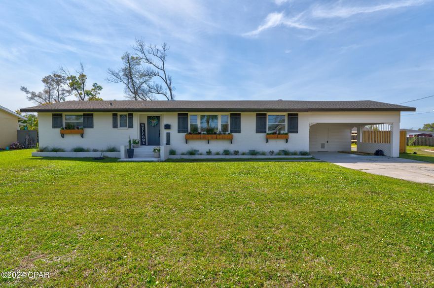 SELLER OFFERING A 2-1 INTEREST RATE BUY DOWN FOR BUYER TO REDUCE INTEREST RATE! Picture yourself living in this recently renovated BEAUTIFUL home right in St. Andrews and the Garden Club district! With WATERVIEWS from your living room - you'll enjoy amazing views in OVER 3,500 square feet of living space at 803 Wood Ave! This home is the perfect blend of modern luxury and classic charm. With 4 bedrooms, 3.5 bathrooms and an additional home office/flex space, this property provides ample space for all your needs.

The open concept layout allows for seamless flow between the living room, dining area, and kitchen. This space is a host's dream, perfect for entertaining guests. The kitchen features stainless steel appliances, gorgeous quartz countertops, a walk-in pantry and plenty of cabinet space for all your storage needs.

Retreat to your oversized master suite, complete with an oversized walk-in closet, updated fixtures, and a beautiful double vanity, modern shower and additional closet space in the bathroom. The three additional bedrooms are spacious and filled with natural light, providing a comfortable space for family members or guests. The office space offers a quiet and productive area for those who work from home or need a study space. Enjoy tiled bathrooms, white bath vanities, lots of natural light and LVP flooring throughout! This renovation was very detailed and this amount of square footage is very rare! Enjoy the amenities of a large home and plenty of bedrooms. 

Situated on a great-sized lot, this property offers a beautiful fenced in backyard with an open deck, perfect for hosting summer barbecues or simply enjoying the outdoors. The back yard has PLENTY of space for a pool to make this the forever home of your dreams. The attached carport provides convenience and additional storage space.

One of the best features of this property is its prime location just TWO BLOCKS away from Beach Drive. You're only a short walk away from some of the city's best dining and entertainment AND bay access with waterfront swings to watch the best sunsets Panama City has to offer. 

Don't miss out on the opportunity to call 803 Wood Ave your new home! With its impeccable design and desirable location, this property offers everything you've been looking for. Schedule a showing today and make this dream home yours!