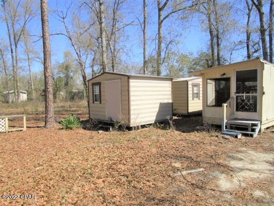 Two sheds will stay with property.  Owner does not live there but believes there is well and septic on property.
