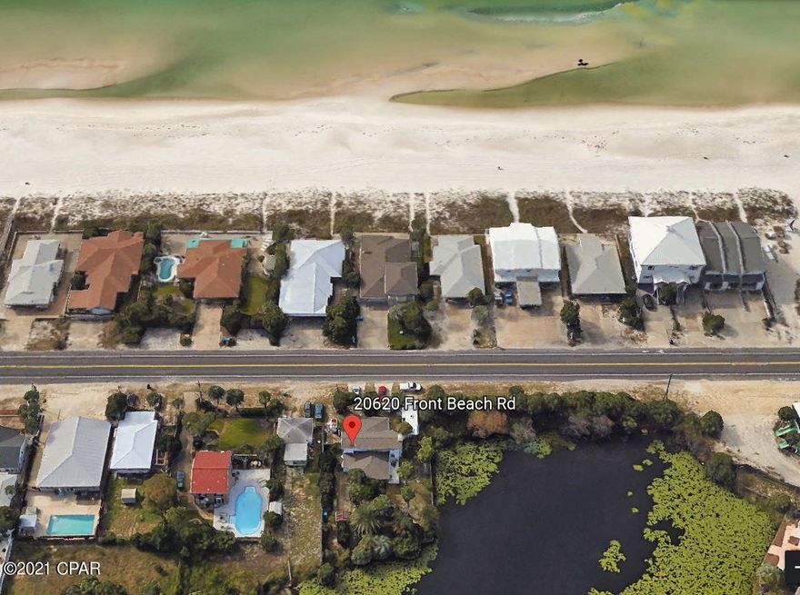 CURRENTLY UNDER CONTRACT, SELLER ACCEPTING BACKUP OFFERS! Waterfront property across the street from the Gulf! Currently has older structure on site. Demo and build up to 2 homes or a duplex with beautiful inland lake views and possible Gulf views. 45 ft building height restriction. See pictures. Build your dream home! Lot is deep, lots of options here. Zoned for C-2 Plaza Commercial but allows residential uses. AS-IS No Repairs. All uses, zoning, sizes, dimensions, and feasibility to be verified by buyer.